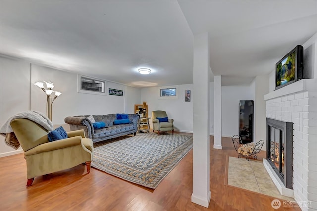 10825 Marine View Dr SW, Seattle, WA 98146 - living area featuring wood finished floors, a fireplace, and baseboards