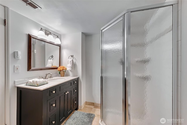 10825 Marine View Dr SW, Seattle, WA 98146 - bathroom with a stall shower, vanity, tile patterned flooring, and baseboards