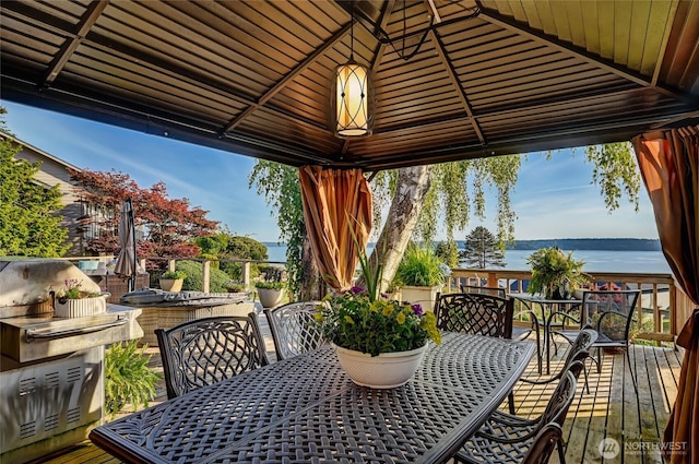 10825 Marine View Dr SW, Seattle, WA 98146 - view of patio / terrace with outdoor dining area, a deck with water view, and a gazebo