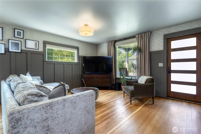 515 S Division St, Walla Walla, WA 99362 - living room with wallpapered walls, a decorative wall, light wood-style floors, and a wainscoted wall