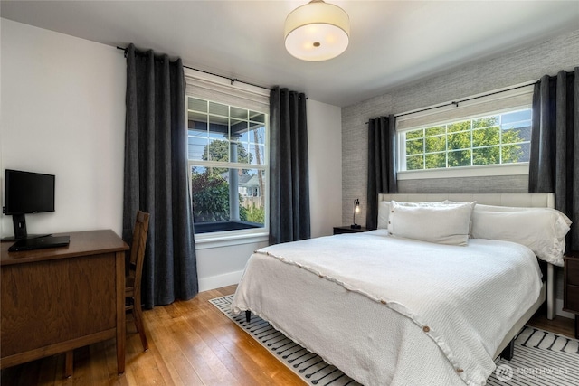 515 S Division St, Walla Walla, WA 99362 - bedroom with hardwood / wood-style flooring, an accent wall, and wallpapered walls