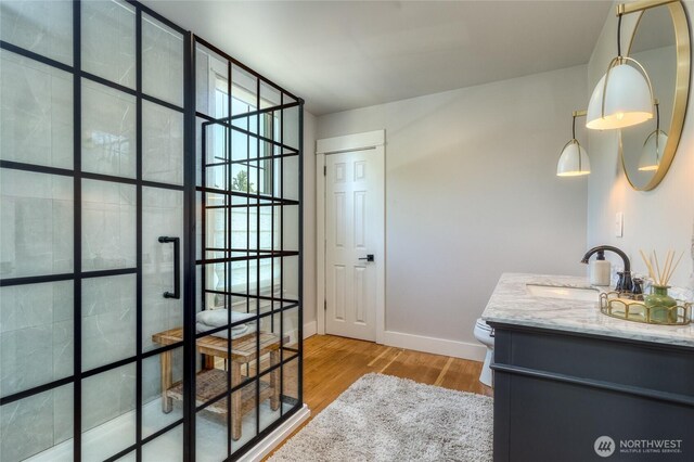 515 S Division St, Walla Walla, WA 99362 - full bathroom featuring vanity, wood finished floors, and a walk in shower