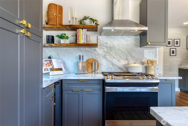 515 S Division St, Walla Walla, WA 99362 - kitchen featuring wall chimney range hood, stainless steel range with gas stovetop, open shelves, decorative backsplash, and dark wood-type flooring
