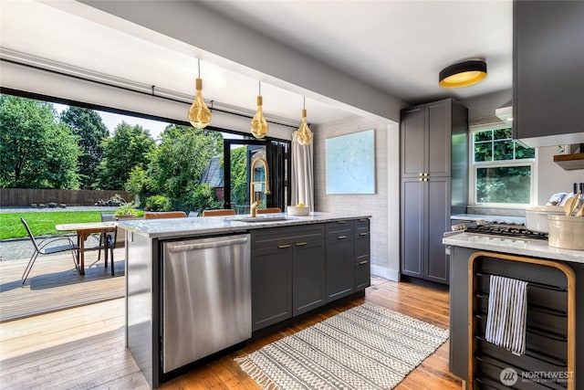 515 S Division St, Walla Walla, WA 99362 - kitchen featuring dishwasher, light stone counters, and plenty of natural light