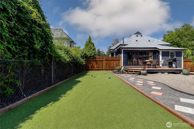 515 S Division St, Walla Walla, WA 99362 - fenced backyard with a bocce ball area and a wooden deck