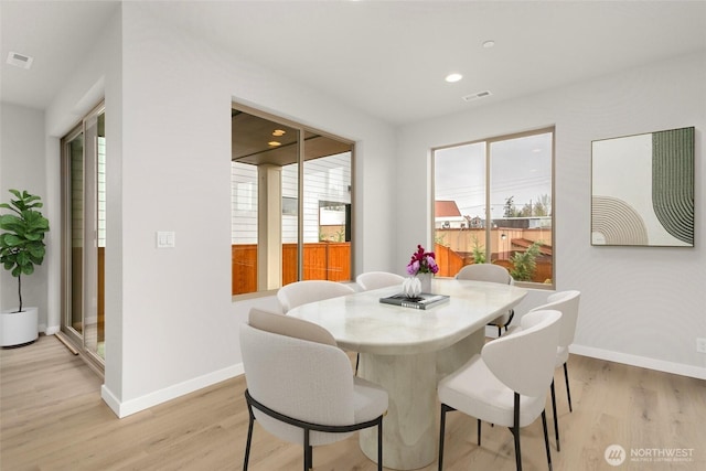 13307 SE 238th Pl Unit 11, Kent, WA 98042 - dining area featuring baseboards, light wood-type flooring, and recessed lighting