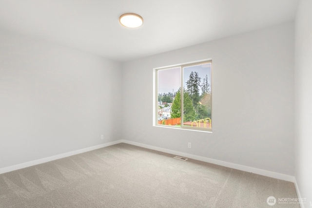 13307 SE 238th Pl Unit 11, Kent, WA 98042 - empty room with baseboards and light carpet