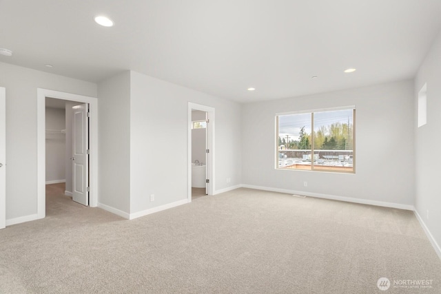 13307 SE 238th Pl Unit 11, Kent, WA 98042 - unfurnished bedroom with carpet floors, baseboards, a spacious closet, recessed lighting, and ensuite bath