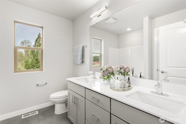 13307 SE 238th Pl Unit 11, Kent, WA 98042 - full bath with double vanity, toilet, and baseboards