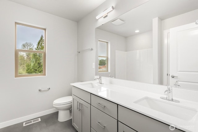 13307 SE 238th Pl Unit 11, Kent, WA 98042 - full bath with double vanity, toilet, and baseboards