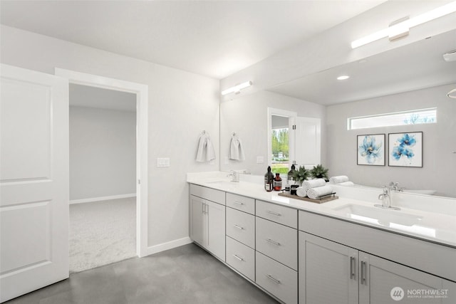 13307 SE 238th Pl Unit 11, Kent, WA 98042 - bathroom with double vanity, baseboards, and concrete flooring