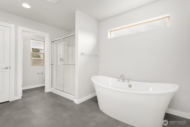 13307 SE 238th Pl Unit 11, Kent, WA 98042 - bathroom featuring baseboards, a soaking tub, a stall shower, and recessed lighting