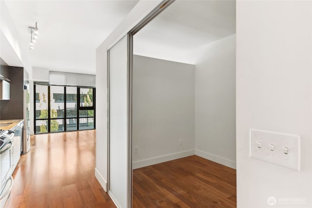 2911 2nd Ave Unit 522, Seattle, WA 98121 - corridor featuring light wood finished floors and baseboards