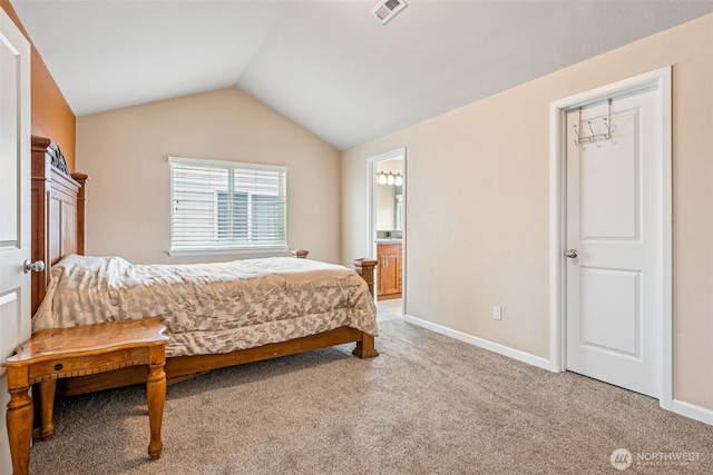 10089 Jensen Dr SE, Yelm, WA 98597 - bedroom featuring light carpet, vaulted ceiling, and connected bathroom