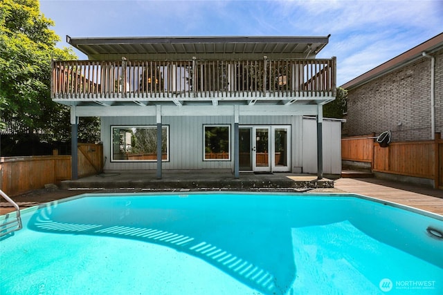3022 47th Ave SW, Seattle, WA 98116 - rear view of property with a fenced backyard, french doors, and a wooden deck