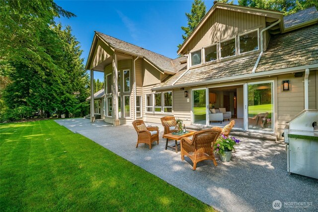 5520 Canvasback Rd, Blaine, WA 98230 - rear view of house with a patio area, a lawn, and an outdoor living space