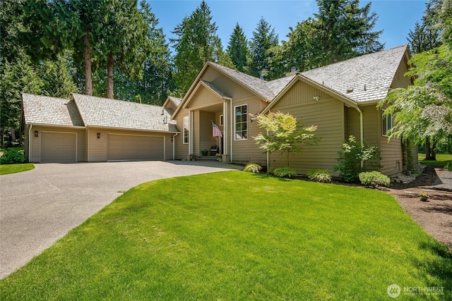 5520 Canvasback Rd, Blaine, WA 98230 - ranch-style home with a garage, concrete driveway, a front yard, and a chimney