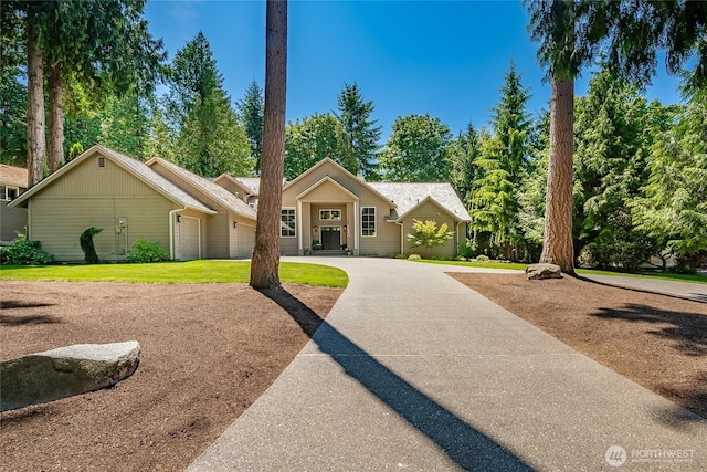 5520 Canvasback Rd, Blaine, WA 98230 - ranch-style house with curved driveway and view of wooded area