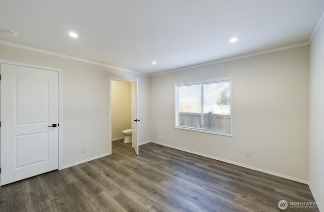 704 N 3rd St, Westport, WA 98595 - unfurnished bedroom with ornamental molding, dark wood-style flooring, baseboards, recessed lighting, and connected bathroom