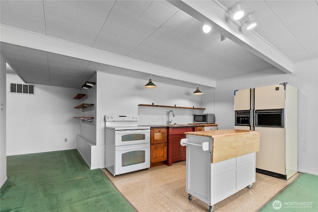 1101 Terrace Dr, Lynden, WA 98264 - kitchen with white appliances, butcher block counters, open shelves, and a kitchen island