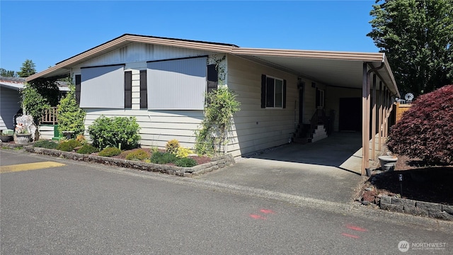 1402 22nd St NE Unit 252, Auburn, WA 98002 - view of front of house with an attached carport