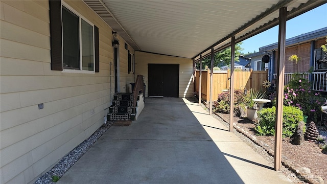 1402 22nd St NE Unit 252, Auburn, WA 98002 - view of patio / terrace with an attached carport