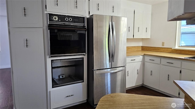 1402 22nd St NE Unit 252, Auburn, WA 98002 - kitchen with freestanding refrigerator, light countertops, white cabinetry, and dark wood-style floors