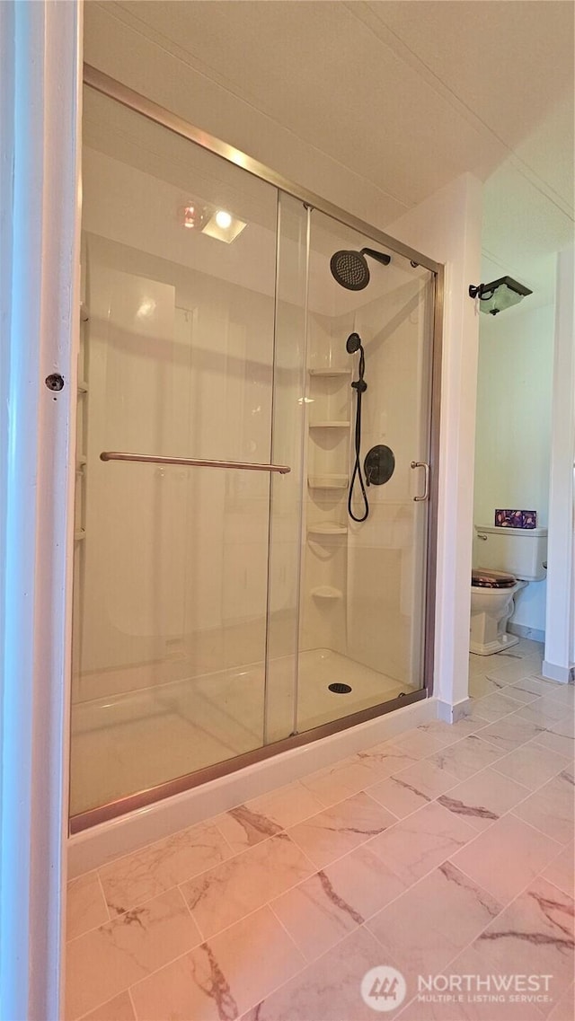 1402 22nd St NE Unit 252, Auburn, WA 98002 - full bath with a stall shower, marble finish floors, and toilet