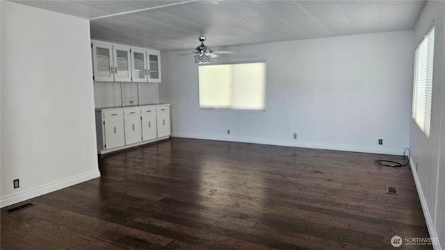 1402 22nd St NE Unit 252, Auburn, WA 98002 - unfurnished room featuring dark wood-style flooring, ceiling fan, and baseboards