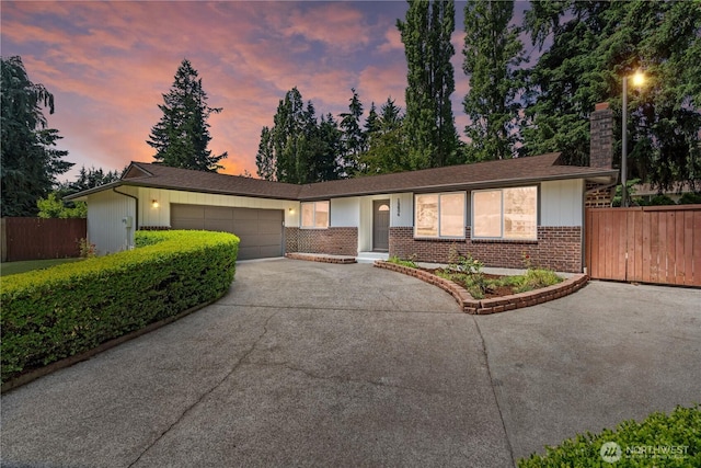 18604 9th Avenue Ct E, Spanaway, WA 98387 - ranch-style home featuring a chimney, concrete driveway, an attached garage, and brick siding