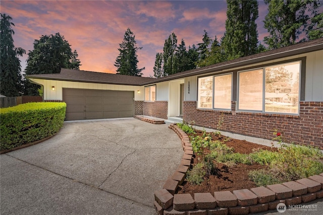18604 9th Avenue Ct E, Spanaway, WA 98387 - single story home with brick siding, driveway, an attached garage, and board and batten siding