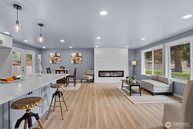 18604 9th Avenue Ct E, Spanaway, WA 98387 - living area with plenty of natural light, recessed lighting, light wood-style floors, and a large fireplace