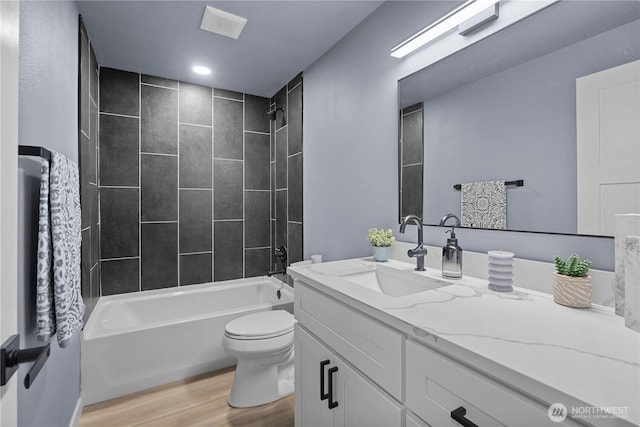 18604 9th Avenue Ct E, Spanaway, WA 98387 - full bath featuring vanity, wood finished floors, and shower / washtub combination