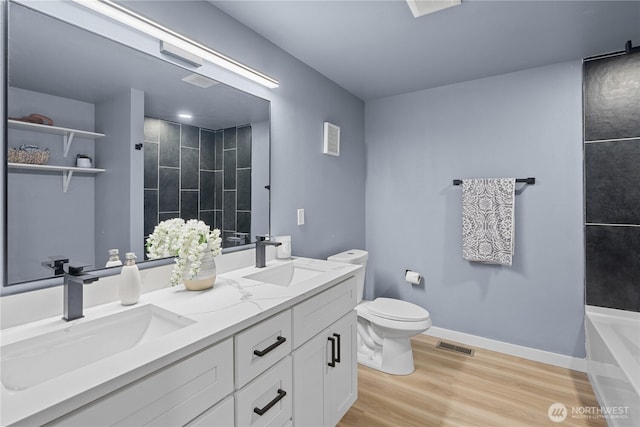 18604 9th Avenue Ct E, Spanaway, WA 98387 - bathroom with double vanity and wood finished floors