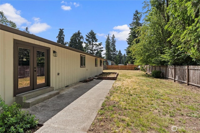 18604 9th Avenue Ct E, Spanaway, WA 98387 - fenced backyard featuring french doors