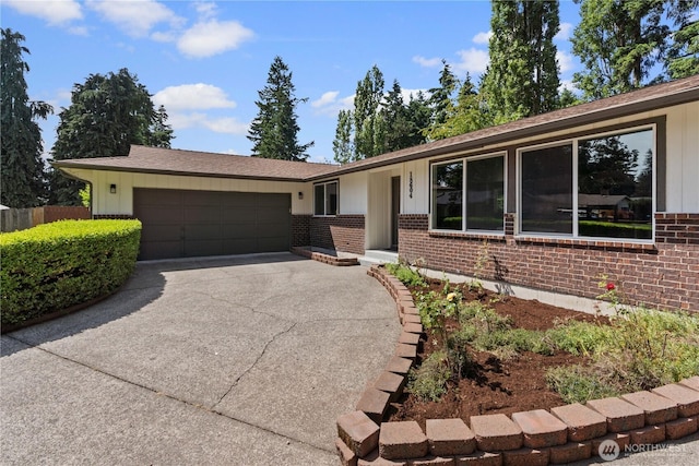 18604 9th Avenue Ct E, Spanaway, WA 98387 - ranch-style house featuring brick siding, driveway, an attached garage, and board and batten siding