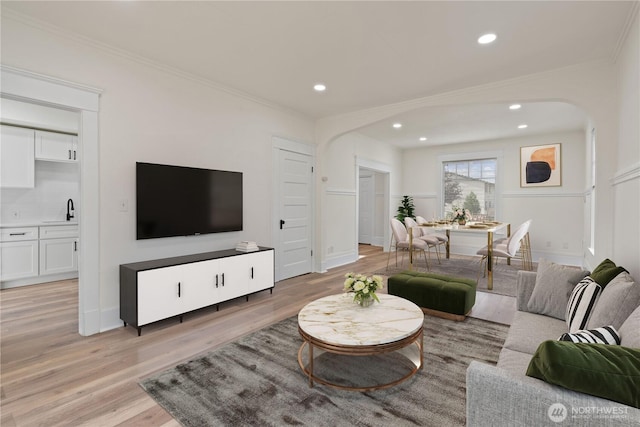 422 S Wright Ave, Tacoma, WA 98418 - living area with arched walkways, ornamental molding, light wood-type flooring, and recessed lighting