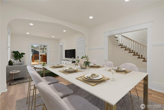422 S Wright Ave, Tacoma, WA 98418 - dining room featuring arched walkways, stairs, light wood finished floors, recessed lighting, and ornamental molding