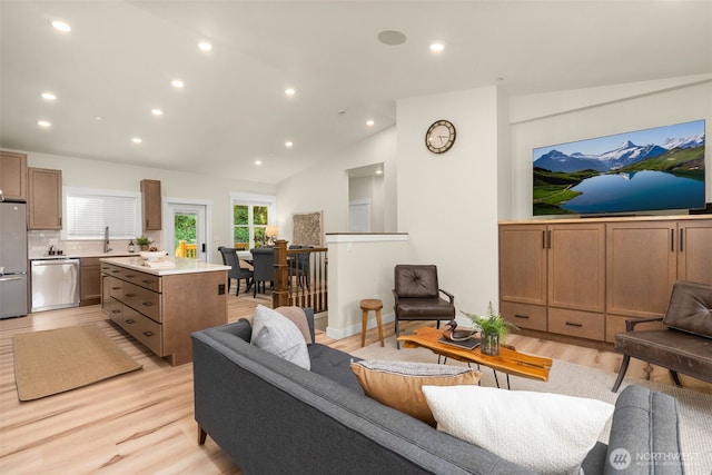 17765 25th Ave NE, Shoreline, WA 98155 - living room featuring light wood finished floors, recessed lighting, and vaulted ceiling
