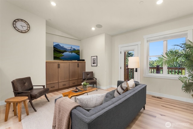 17765 25th Ave NE, Shoreline, WA 98155 - living room with light wood-type flooring, vaulted ceiling, baseboards, and recessed lighting