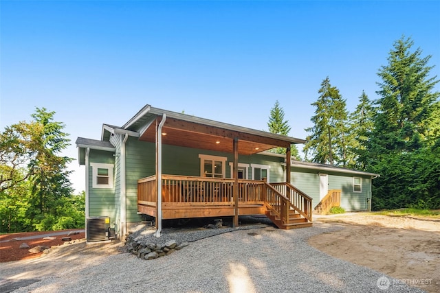 17765 25th Ave NE, Shoreline, WA 98155 - view of front of house with cooling unit and a wooden deck