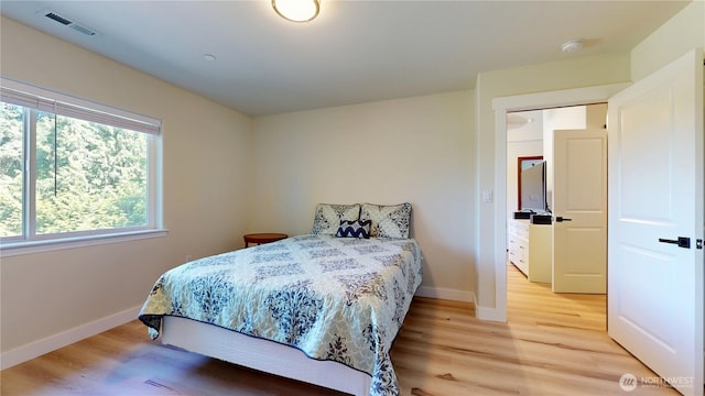 17765 25th Ave NE, Shoreline, WA 98155 - bedroom featuring light wood-type flooring and baseboards