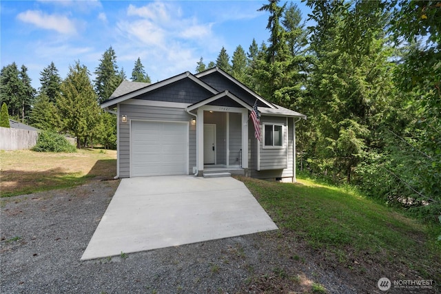 17621 Vine Ln SE, Yelm, WA 98597 - view of front facade with concrete driveway, an attached garage, a front lawn, and crawl space