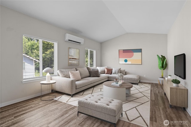 17621 Vine Ln SE, Yelm, WA 98597 - living area featuring a wall mounted AC, plenty of natural light, wood finished floors, and vaulted ceiling