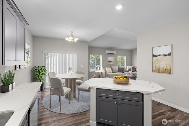 17621 Vine Ln SE, Yelm, WA 98597 - kitchen featuring gray cabinets, an AC wall unit, dark wood-style floors, a chandelier, and recessed lighting
