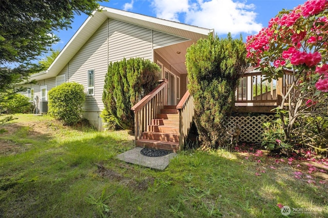 5 Bayview Ln, Hoquiam, WA 98550 - rear view of house featuring a lawn, a wooden deck, and stairs