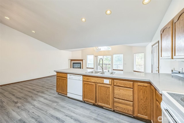 5 Bayview Ln, Hoquiam, WA 98550 - kitchen with dishwasher, a sink, vaulted ceiling, a peninsula, and light countertops