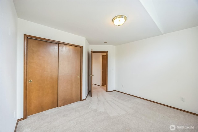 5 Bayview Ln, Hoquiam, WA 98550 - unfurnished bedroom featuring light colored carpet, a closet, and baseboards