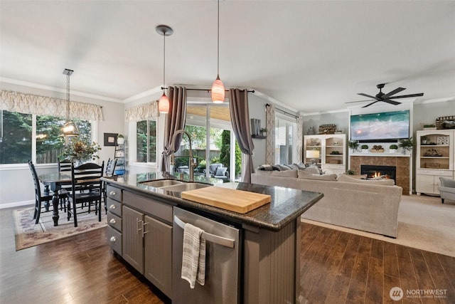 19409 90th Avenue Ct E, Graham, WA 98338 - kitchen featuring stainless steel dishwasher, a sink, crown molding, dark countertops, and ceiling fan