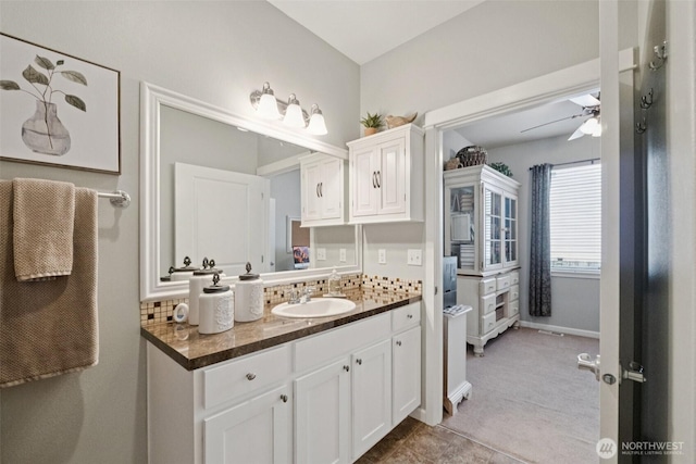 19409 90th Avenue Ct E, Graham, WA 98338 - bathroom with ceiling fan, vanity, and decorative backsplash
